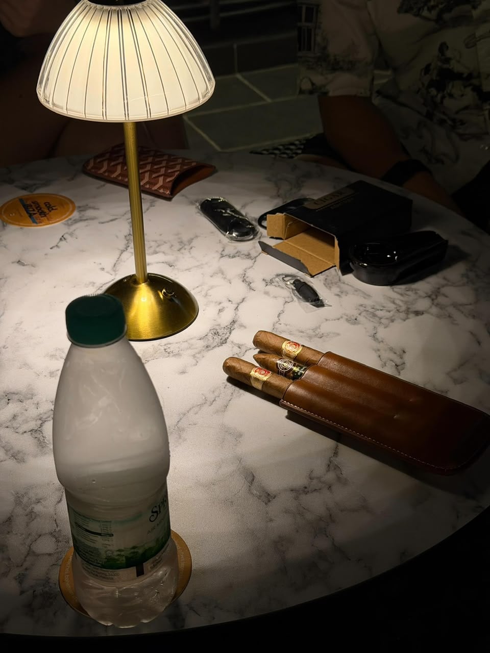 Marble tables, table lamps — never overheads.